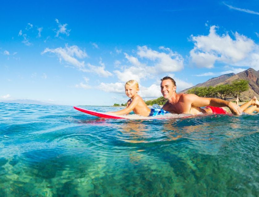 molokai, MOLOKIA SURFING FATHER AND YOUNG SON SURFING